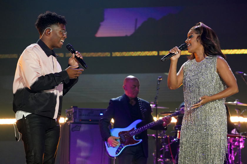 Breland performs with Mickey Guyton