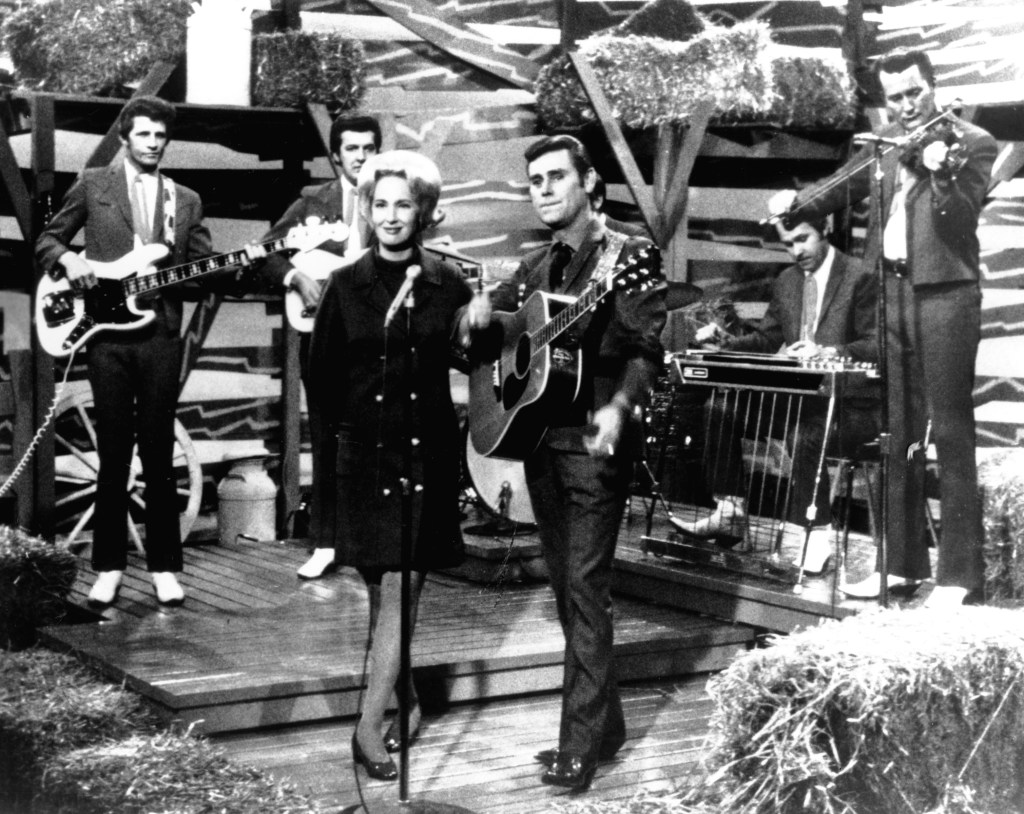 Tammy Wynette and George Jones Perform on stage with the Jones Boys in circa 1972.
