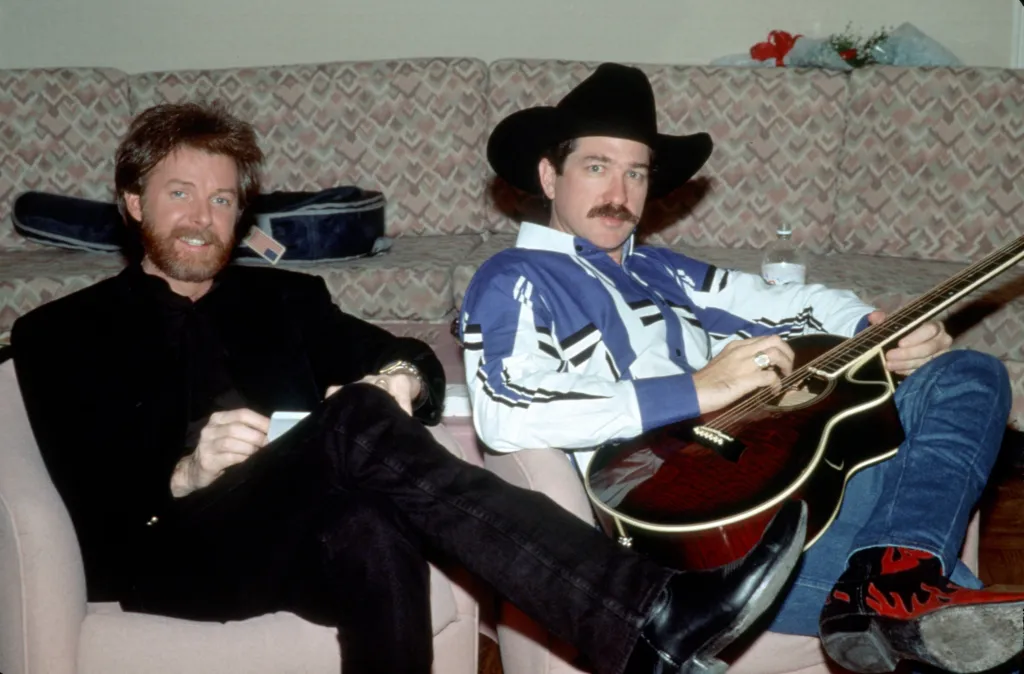 LAS VEGAS - DECEMBER 1994: Kix Brooks (L) and Ronnie Dunn (R) of the country music duo Brooks & Dunn relax backstage at Caesar's Palace in Las Vegas, Nevada in December, 1994. 