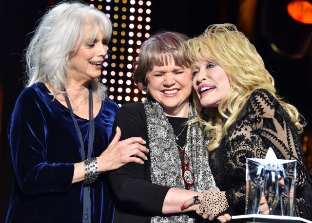 Emmylou Harris and Linda Ronstadt present the MusiCares Person of the Year award to Dolly Parton onstage during MusiCares Person of the Year honoring Dolly Parton at Los Angeles Convention Center on February 8, 2019 in Los Angeles, California.