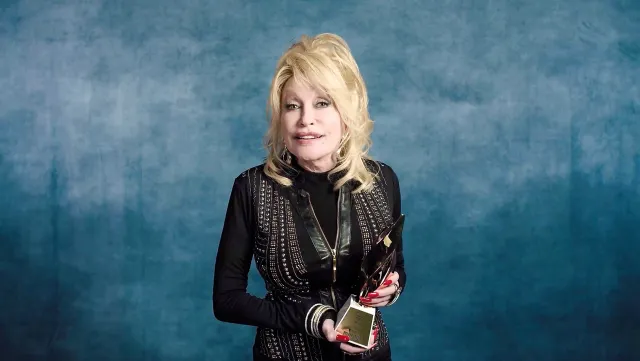 Dolly Parton accepts the Hitmaker Award during the Billboard Women In Music 2020 event on December 10, 2020. (Photo by 2020 Billboard Women In Music