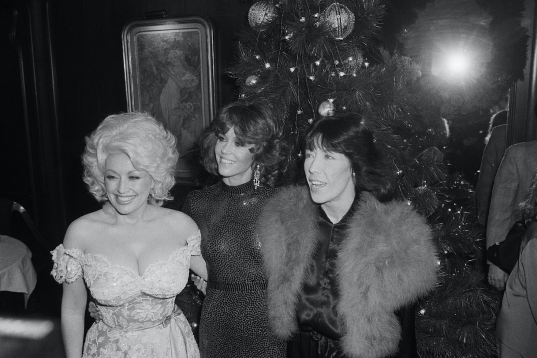 (Original Caption) 12/15/80-New York: Dolly Parton, Jane Fonda and Lily Tomlin (L to R) attend a 12/14 benefit showing of "Nine to Five," their new film about the travails of life in the secreterial pool. Benefit was dedicated to Working Woman, a national organization for office workers.