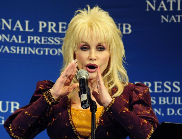 Country music singer Dolly Parton addresses an audience on February 10, 2009 at the National Press Club in Washington, DC. Parton was inducted into the Gospel Music Hall of Fame last week. 