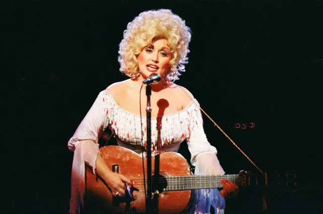 Dolly Parton performs on stage at The Dominion Theatre on March 29th, 1983 in London, United Kingdom