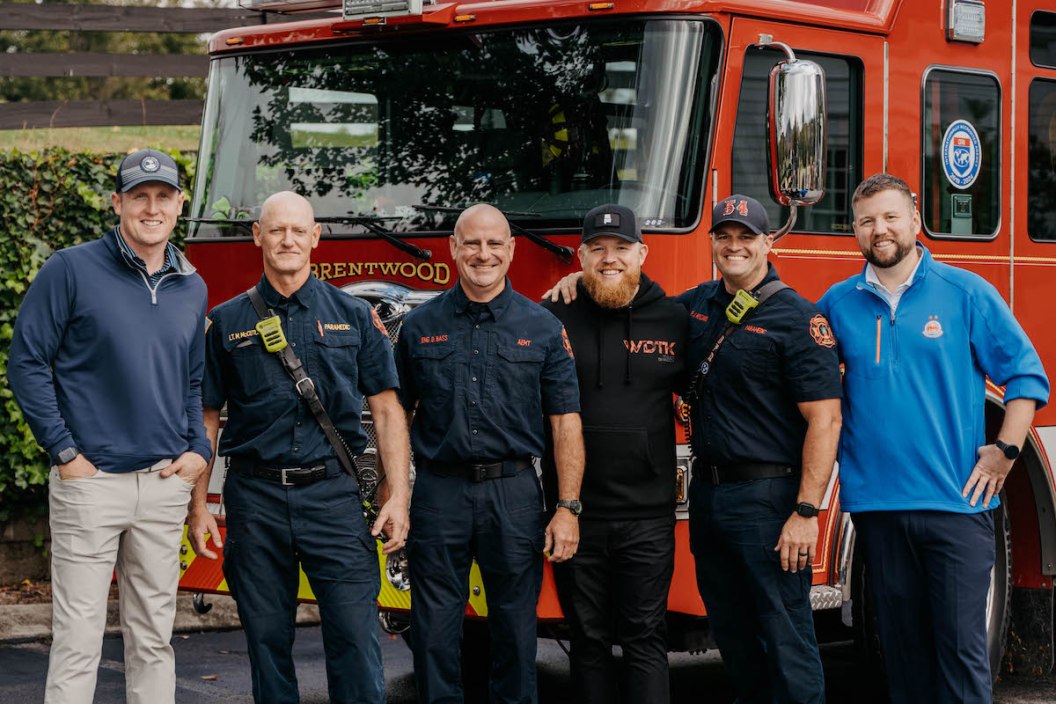 Tyler Braden poses with former firefighter colleagues at a charity golf event.