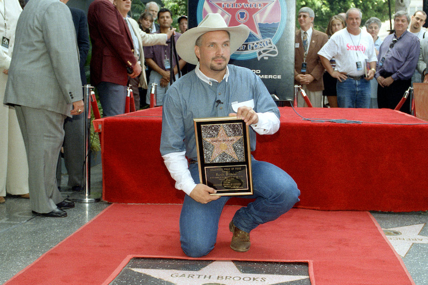 American country singer and songwriter Garth Brooks poses for a portrait as he gets a star on the Hollywood Walk of Fame on June 30, 1995 in Hollywood, California. (Photo by Lester Coh