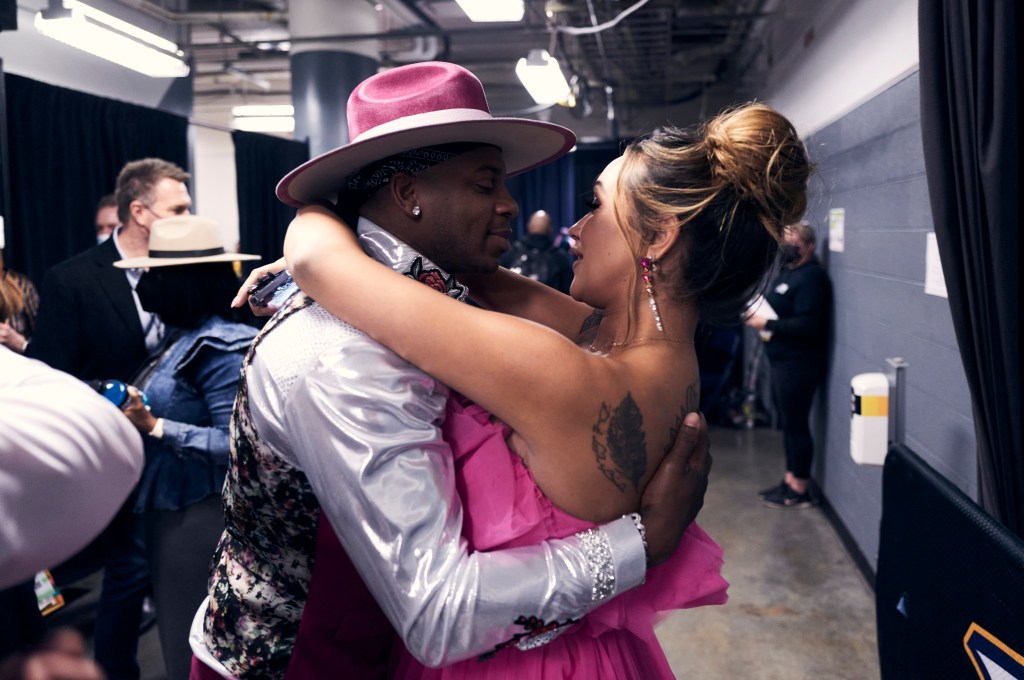 NASHVILLE, TENNESSEE - NOVEMBER 10: Jimmie Allen and Alexis Gale backstage during the 55th annual Country Music Association awards at the Bridgestone Arena on November 10, 2021 in Nashville, Tennessee. (Photo by John Shearer/Getty Images for CMA)
