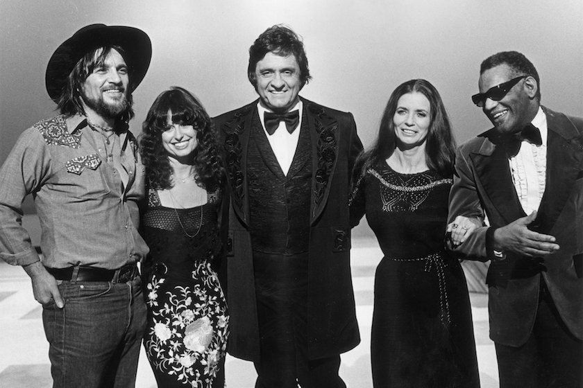 American country singer Johnny Cash (1932 - 2003, center) stands with his guests (left to right) Waylon Jennings (1937 - 2002); Jessi Colter; his wife, June Carter Cash (1929 - 2003); and singer Ray Charles, in a promotional portrait from Cash's television special 'Johnny Cash; Spring Fever'. 