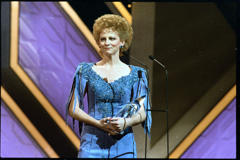 Reba McEntire tearfully accepts the award for "Entertainer of the Year" during Country Music Association awards presentations 10/13 night.