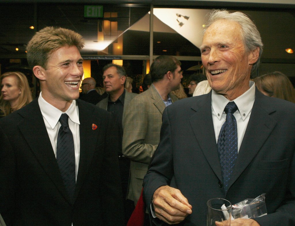 Actor Scott Eastwood and his father, actor-director Clint Eastwood, talk at the after-party for the premiere of Paramount's <em>Flags of Our Fathers</em> at the Academy of Motion Picture Arts and Sciences on October 9, 2006 in Beverly Hills, California.