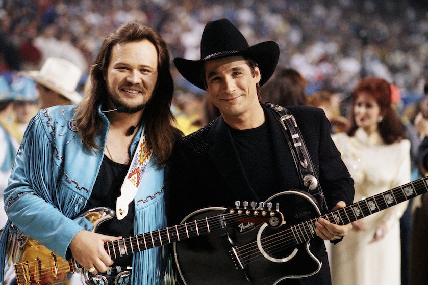 ATLANTA, GA - 1994: Country singer Travis Tritt (left) and Clint Black pose together before the half-time show at the 1994 Atlanta, Georgia, Superbowl XXVII football game held at the Georgia Dome. 