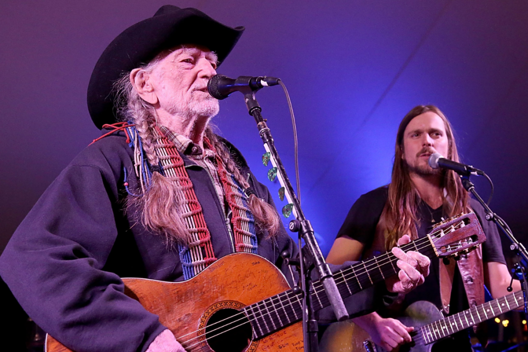 Willie Nelson (L) and Lukas Nelson perform in concert during the Luck Welcome dinner benefitting Farm Aid on March 14, 2018 in Spicewood, Texas. (Photo by Gary Miller/Getty Images)