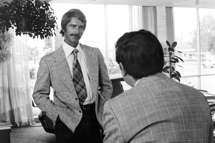 Sam Elliott talking to man in office in a scene from the film 'Lifeguard', 1976