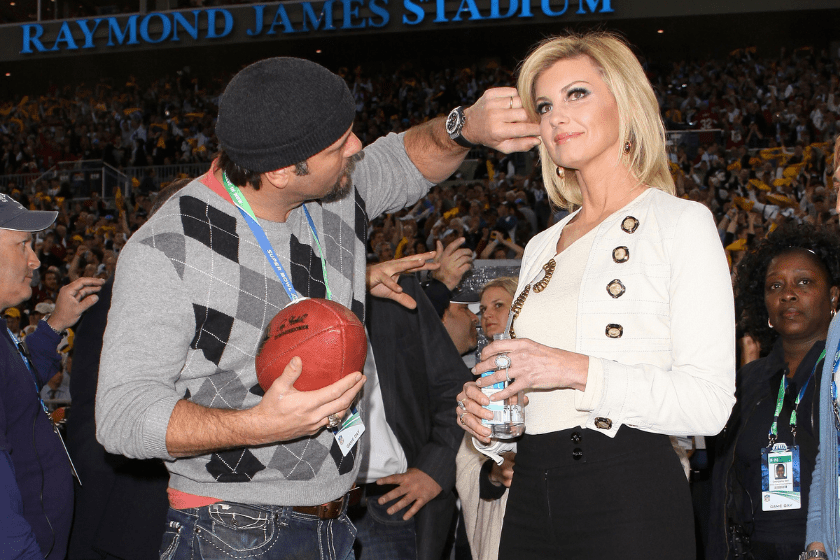 Musicians Tim McGraw and Faith Hill prepare before the pre-game show prior to the start of Super Bowl XLIII between the Arizona Cardinals and the Pittsburgh Steelers