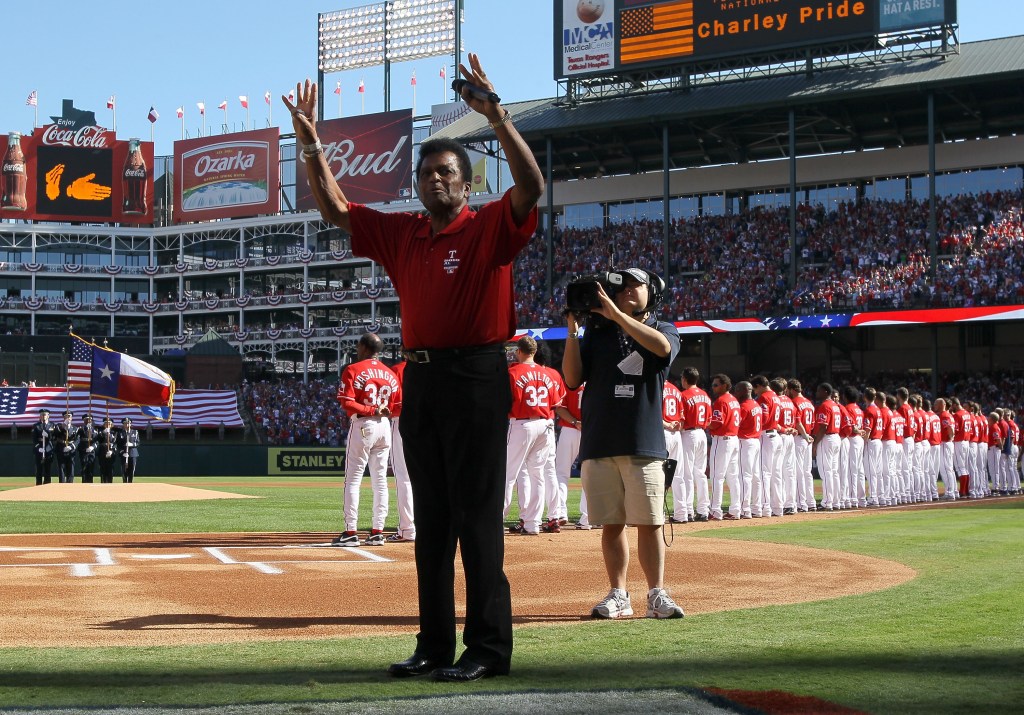 Country singer Charley Pride waves after singing the national anthem before game three of the ALDSthe Tampa Bay Rays and the Texas Rangers at Rangers Ballpark in Arlington on October 9, 2010 in Arlington, Texas. (Photo by Stephen Dunn/Getty Images)