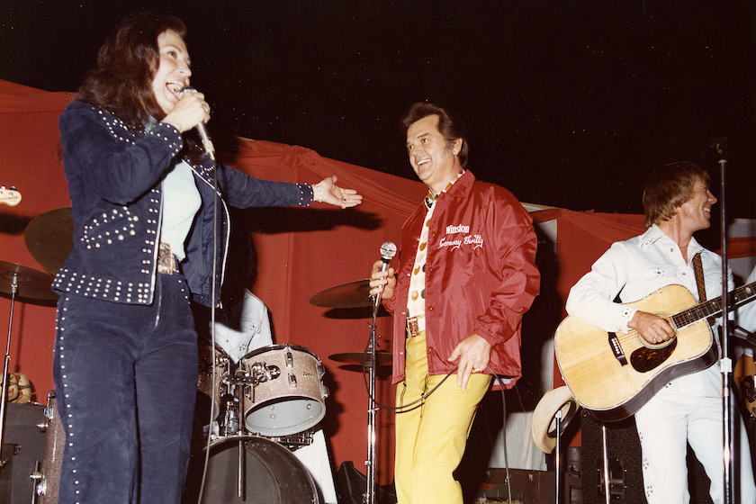 Charlotte Motor Speedway has always been known for bringing in top entertainment for the fans prior to races. Here country & western superstars Loretta Lynn and Conway Twitty perform for the crowd prior to a NASCAR event.