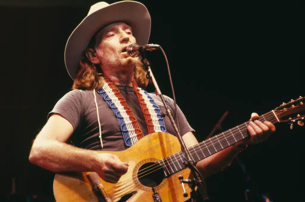 Willie Nelson, U.S. country music singer-songwriter, during a concert performance, circa 1975.