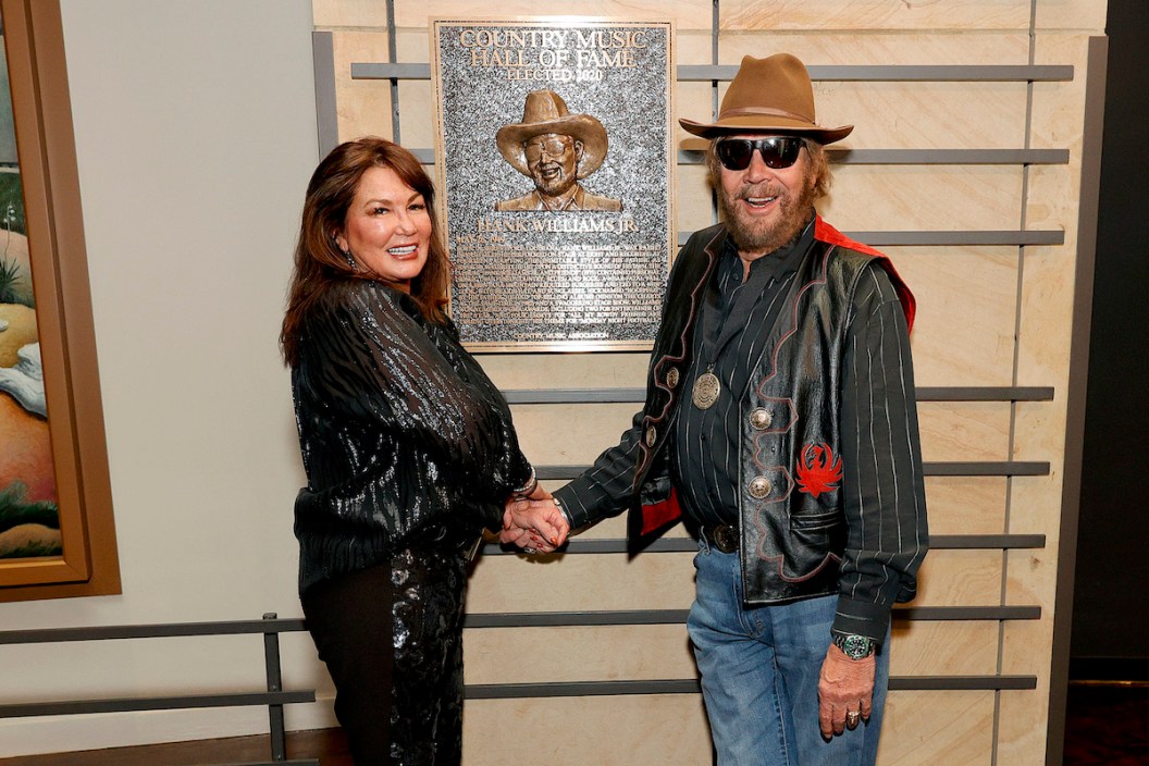 Mary Jane Thomas and 2020 inductee Hank Williams Jr. seen during the 2021 Medallion Ceremony, celebrating the Induction of the Class of 2020 at Country Music Hall of Fame and Museum on November 21, 2021 in Nashville.