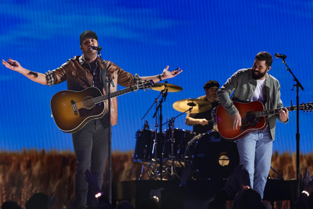 Luke Bryan and Jordan Davis perform onstage during rehearsals for the 57th Academy Of Country Music Awards at Allegiant Stadium on March 05, 2022 in Las Vegas.