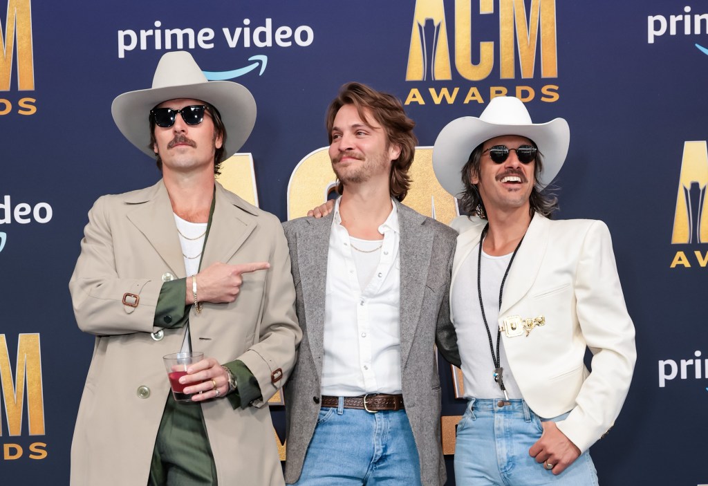 LAS VEGAS, NEVADA - MARCH 07: Luke Grimes (C) poses with Mark Wystrach (L) and Cameron Duddy (R) of Midland during the 57th Academy of Country Music Awards at Allegiant Stadium on March 07, 2022 in Las Vegas, Nevada. (Photo by Jason Kempin/Getty Images for ACM)