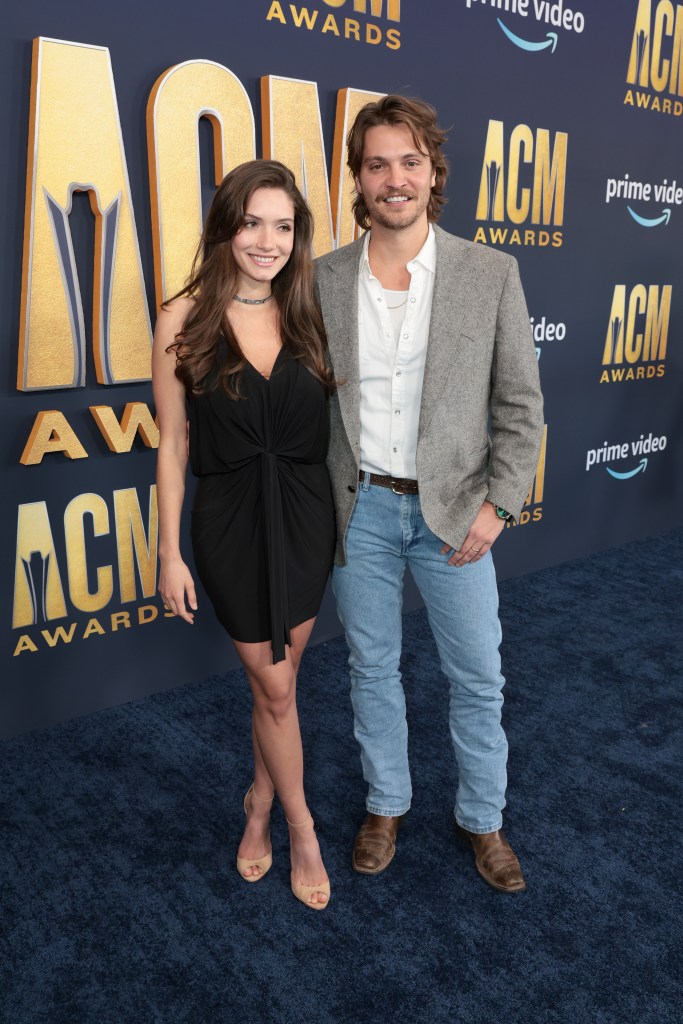 LAS VEGAS, NEVADA - MARCH 07: Luke Grimes (R) and Bianca Rodrigues attend the 57th Academy of Country Music Awards at Allegiant Stadium on March 07, 2022 in Las Vegas, Nevada. (Photo by Jason Kempin/Getty Images for ACM)