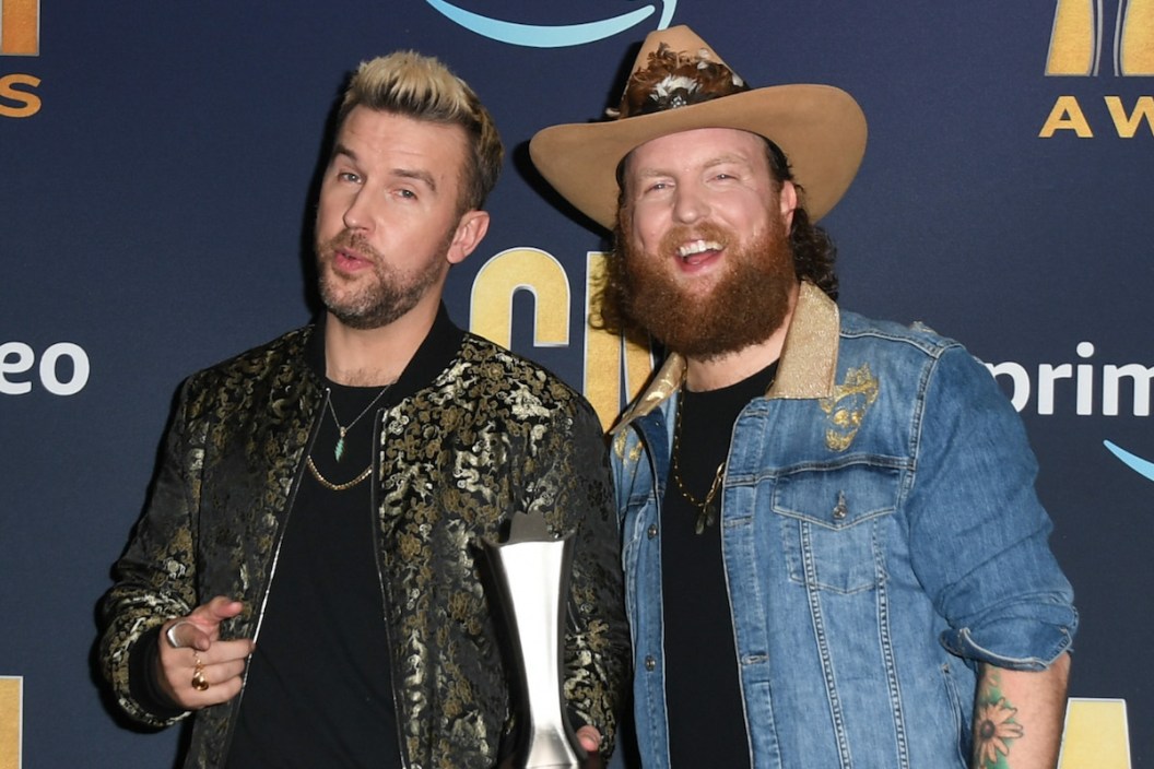 T.J. Osborne (L) and John Osborne of Brothers Osborne, winners of the Duo of the Year award, pose in the press room during the 57th Academy of Country Music Awards at Allegiant Stadium on March 07, 2022 in Las Vegas.