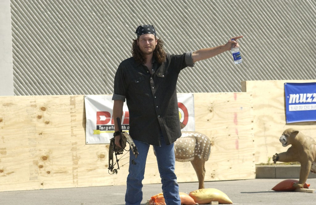 Singer Blake Shelton prepares to compete in the Andy Griggs Celebrity Archery tournament during the 32nd annual FanFair country music festival June 5, 2003 in Nashville, Tennessee. The four-day festival, staged by the Country Music Association, is the largest of its kind and offers fans close access to many of country music's biggest stars as well as nightly concerts featuring the genre's top performers.