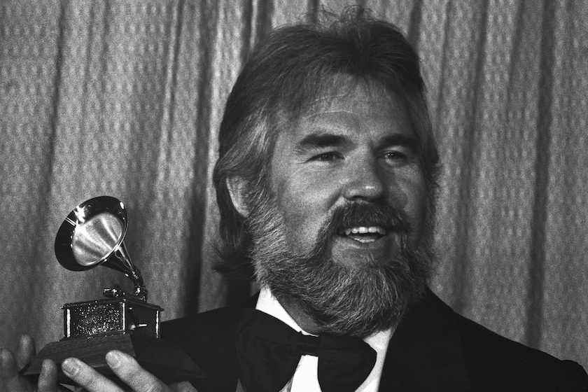 Kenny Rogers holds his Grammy Award during ceremonies at the 20th annual edition of the awards 2/23. The Best Country Vocal Performance grammy by a male went to Kenny Rogers for his song "Lucille."