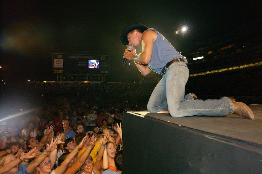 Kenny Chesney performs June 13, 2002 at the 31st Annual Fan Fair in Nashville, Tennessee. The four-day event is billed as the world's largest country music festival and features concerts, fan club parties and opportunities to meet the stars. 