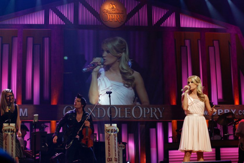 NASHVILLE, TN - OCTOBER 02: Carrie Underwood visits the Grand Ole Opry House to flip a switch to turn the backdrop pink to symbolize the fight against breast cancer on October 2, 2009 in Nashville, Tennessee. 