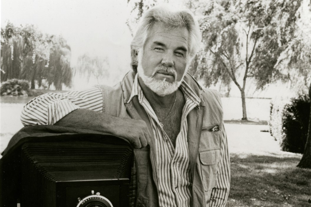 Kenny Rogers with one of his favorite creative mediums: a camera.