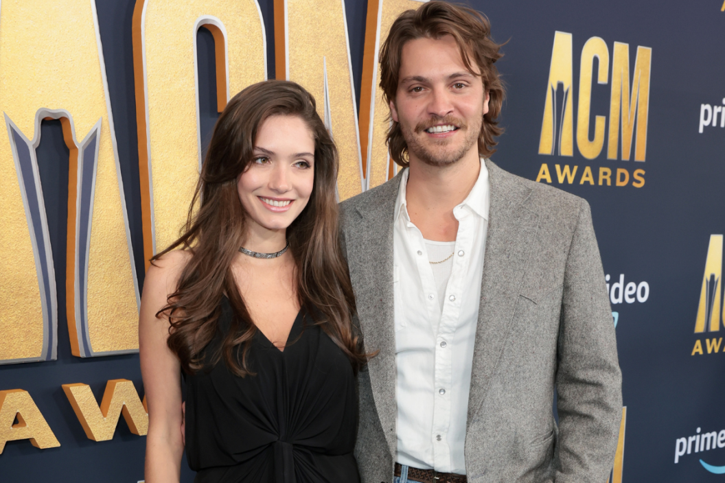 Luke Grimes (R) and Bianca Rodrigues attend the 57th Academy of Country Music Awards at Allegiant Stadium on March 07, 2022 in Las Vegas, Nevada. (Photo by Jason Kempin/Getty Images for ACM)
