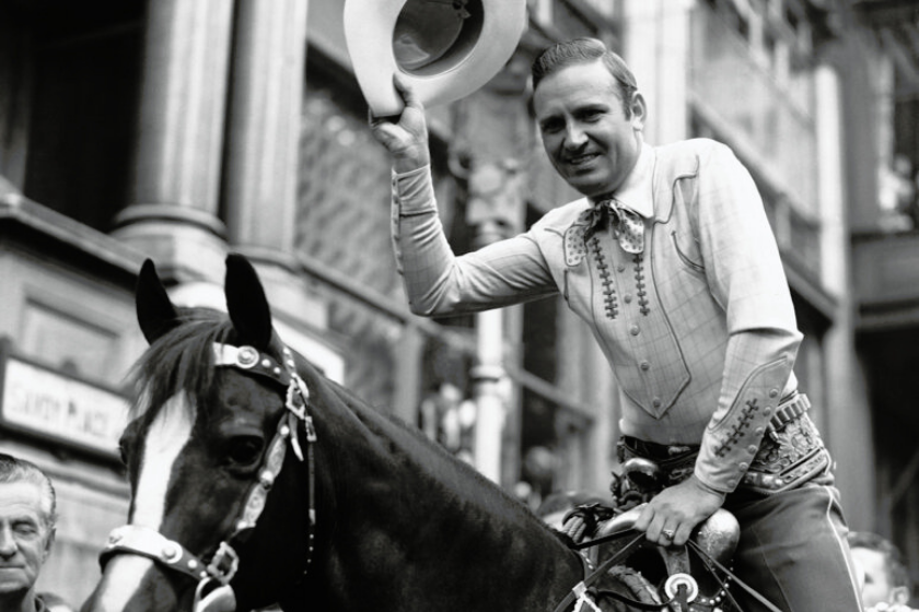 Gene Autry, Hollywood's number one cowboy, held a reception at the Savoy Hotel, and of course, has horse was there too. Gene Autry on his horse outside the Savoy Hotel, in London, England on August 2, 1939