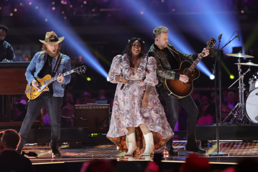 Brittney Spencer (C) performs with John Osborne (L) and T.J. Osborne (R) of Brothers Osborne onstage during the 57th Academy of Country Music Awards