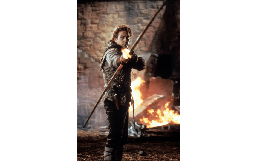 Kevin Costner pulls a bow in a scene from the film 'Robin Hood: Prince Of Thieves', 1991