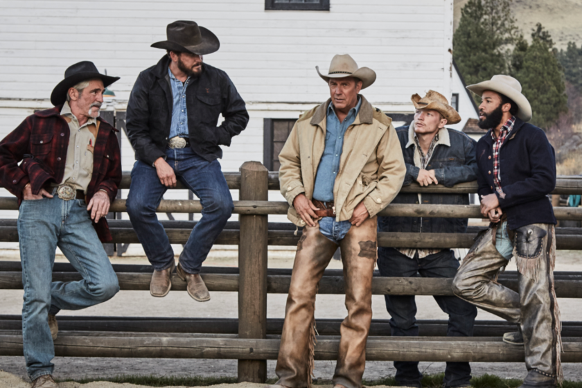 Kevin Costner as John Dutton surrounded by ranch hands on the set of 'Yellowstone'