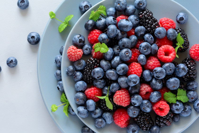 Blueberries and raspberries on plate