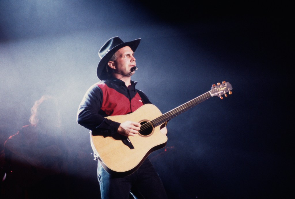 American singer-songwriter Garth Brooks performing on stage, 1994. 