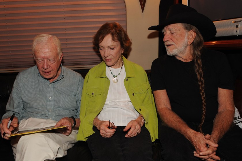 Former President Jimmy Carter, Rosalynn Carter and Willie Nelson on Nelson's tour bus backstage at Chastain Park Amphitheater on July 27, 2008 in Atlanta, Georgia.