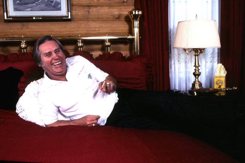 NASHVILLE -January 1: Country Music Singer George Jones on the bed in his home on January 1, 1984 in Colmesneil, Texas 