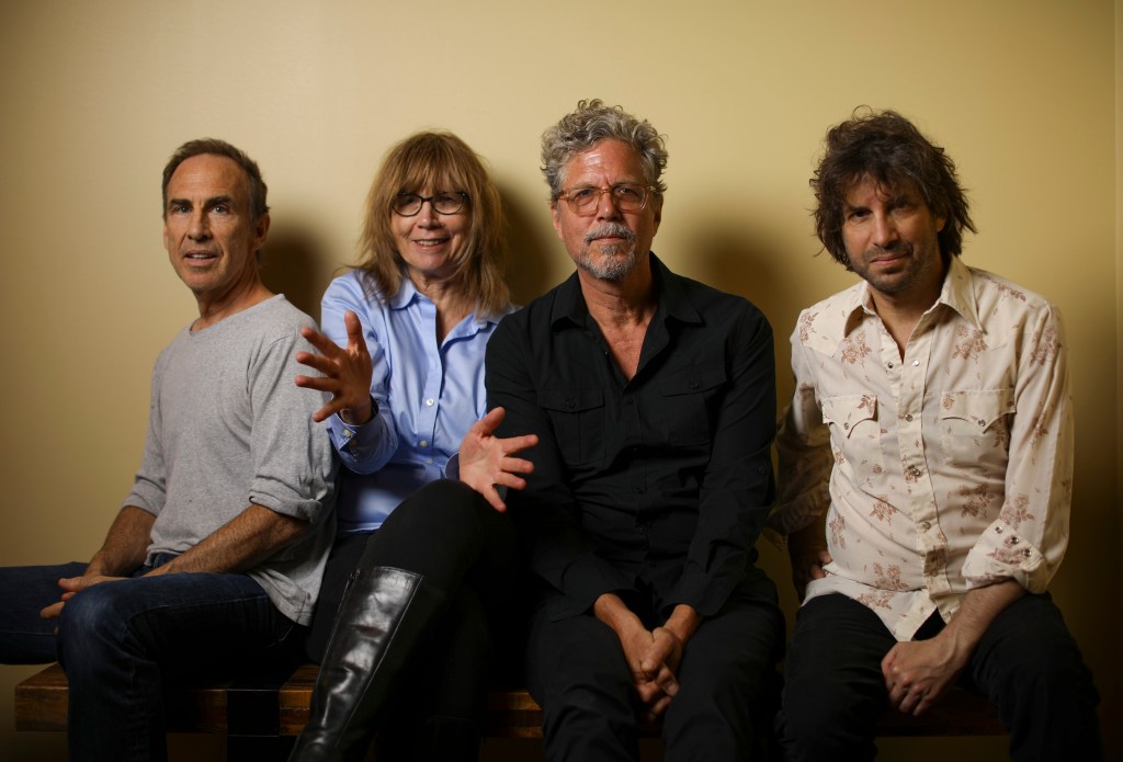 The Jayhawks, photographed before going on stage last month. They are, from left, Tim O'Reagan, Karen Grotberg, Gary Louris, and Mark Perlman. They were photographed before playing a private party.