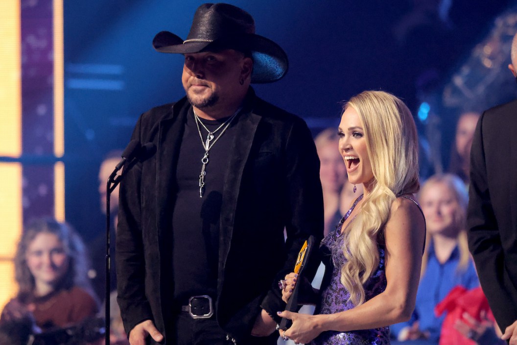 Jason Aldean and Carrie Underwood accept an award for Collaborative Video of the Year at the 2022 CMT Music Awards at Nashville Municipal Auditorium on April 11, 2022 in Nashville.