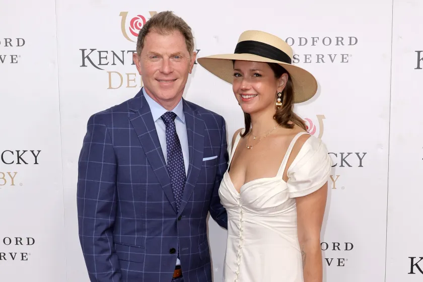 LOUISVILLE, KENTUCKY - MAY 07: Bobby Flay and Christina Pérez attend the 148th Kentucky Derby at Churchill Downs on May 07, 2022 in Louisville, Kentucky. 