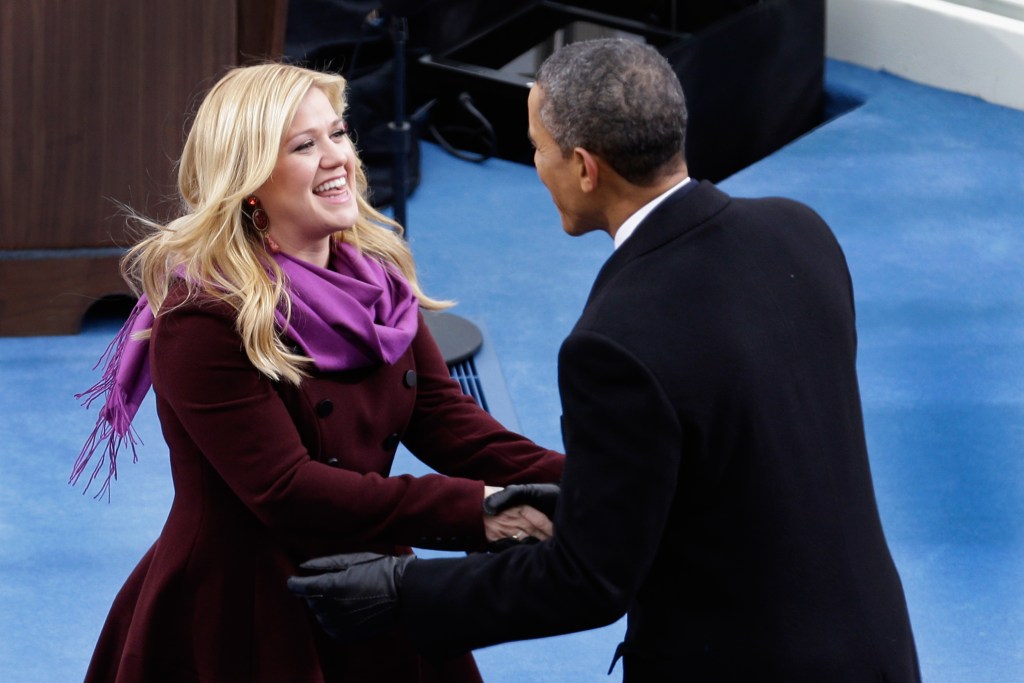 U.S. President Barack Obama greets singer Kelly Clarkson after her performance of 'My Country, 'Tis of Thee' during the public ceremonial inauguration on the West Front of the U.S. Capitol January 21, 2013 in Washington, DC. Barack Obama was re-elected for a second term as President of the United States.