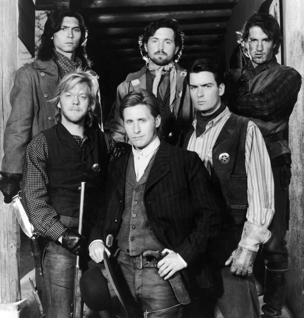 Promotional portrait of the cast of the film, 'Young Guns,' directed by Christopher Cain. Left to right, (top): Lou Diamond Phillips, Casey Siemaszko, and Dermot Mulroney (bottom) Kiefer Sutherland, Emilio Estevez and Charlie Sheen. 