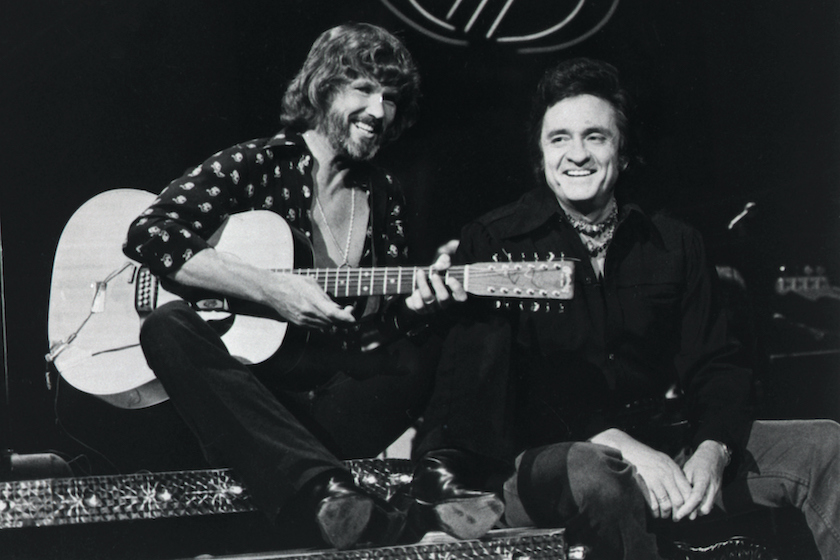 (Original Caption) 9/15/1976-Kris Kristofferson (L) and Johnny Cash perform a duet on "The Johnny Cash Show."