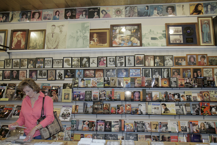 A woman looking at CDs in Ernest Tubb Record Shop.
