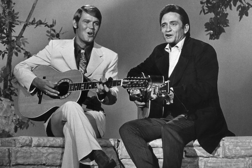 JULY 12: Country singers Glen Campbell and Johnny Cash appear together with acoustic guitars on "The Johnny Cash Show" on July 12, 1969.