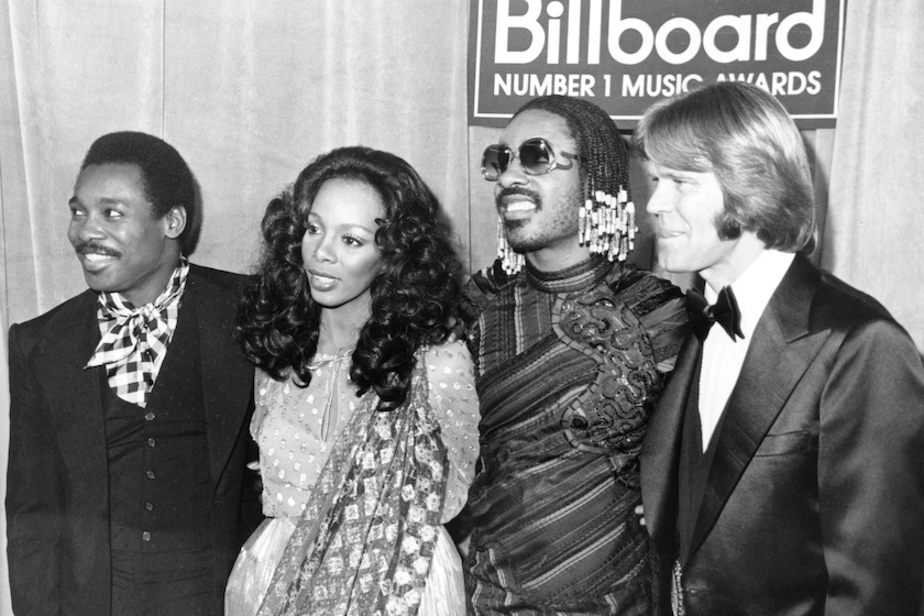 Superstars George Benson, Donna Summer, Stevie Wonder and Glen Campbell attend the "Billboard Number 1 Music Awards" in circa 1980. 