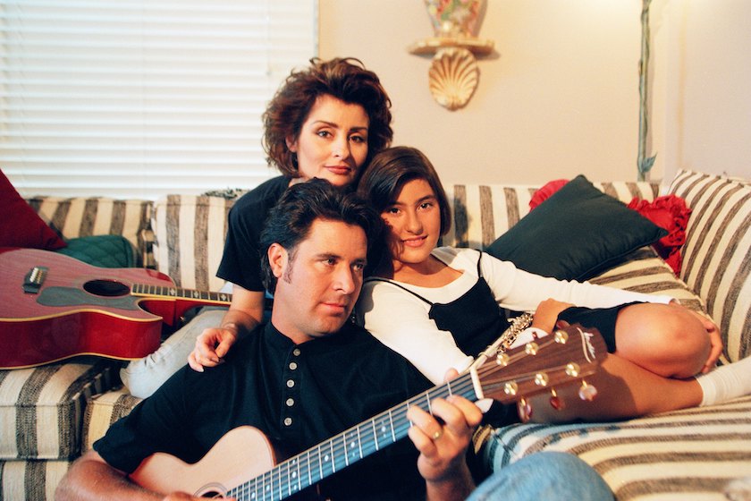 Singer Vince Gill poses for a photo with his wife, Janis Gill, and daughter Jenny Gill during a circa 1990s photo shoot at their home in Nashville, Tennessee. 